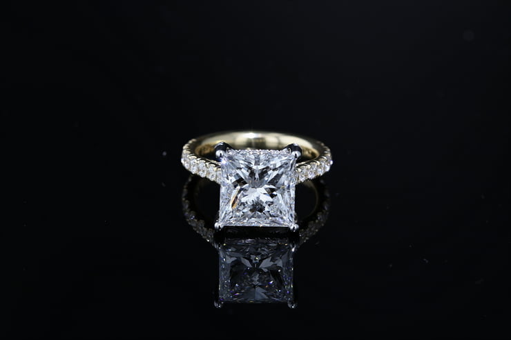 Princess side stone engagement ring