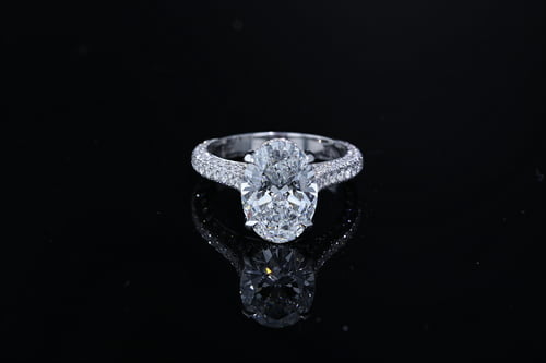 Oval shaped three sided engagement ring