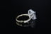 Princess side stone engagement ring