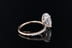 Oval brilliant cut diamond solitaire engagement ring with pave set round brilliant cut diamonds