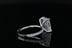 Radiant cut diamond solitaire with pave set diamond hidden halo