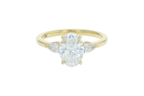 Oval Three Stone Yellow Gold Ring With Two Pears