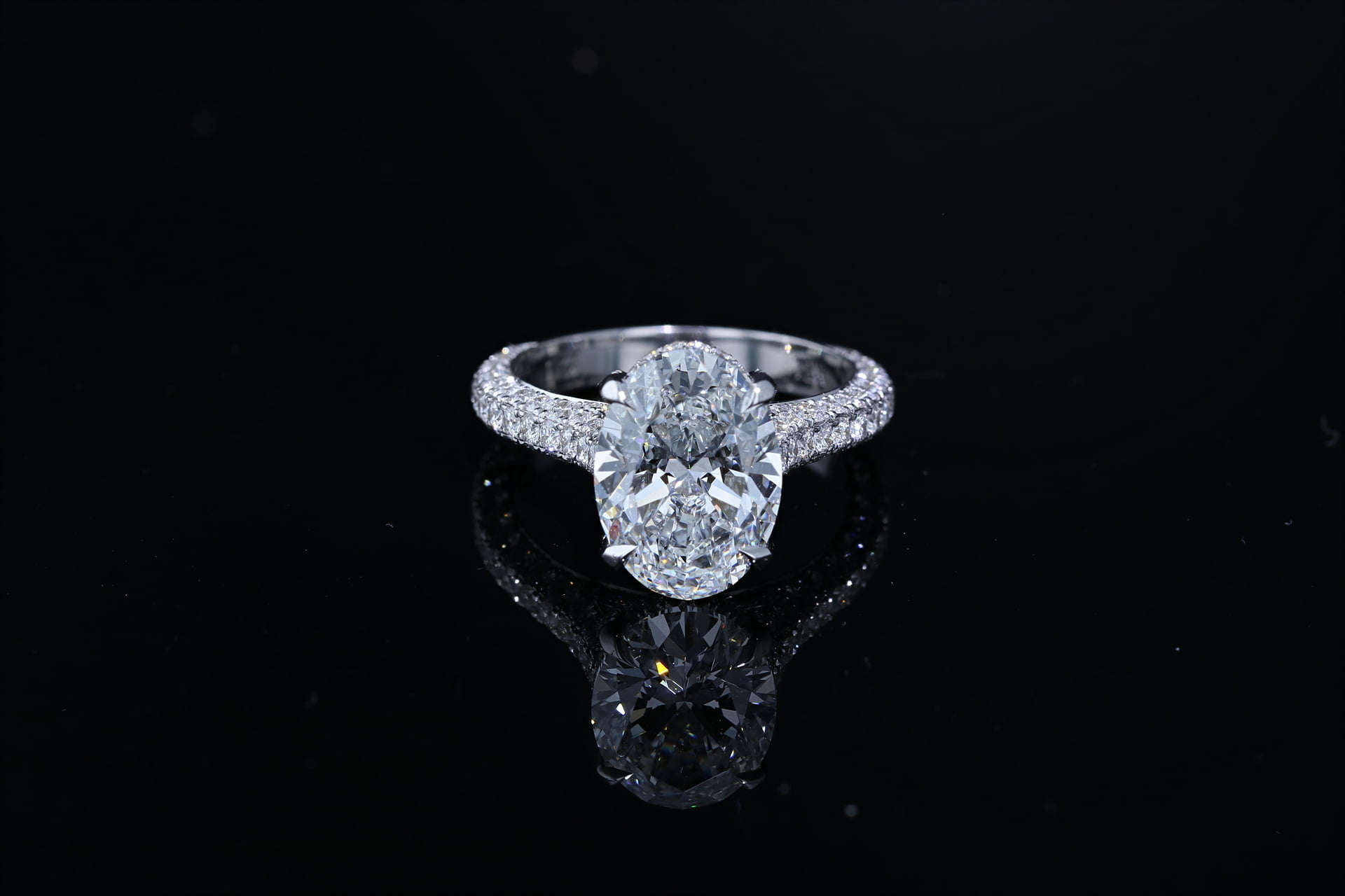 Oval shaped Diamond Ring with Three-sided Pave' Set Band