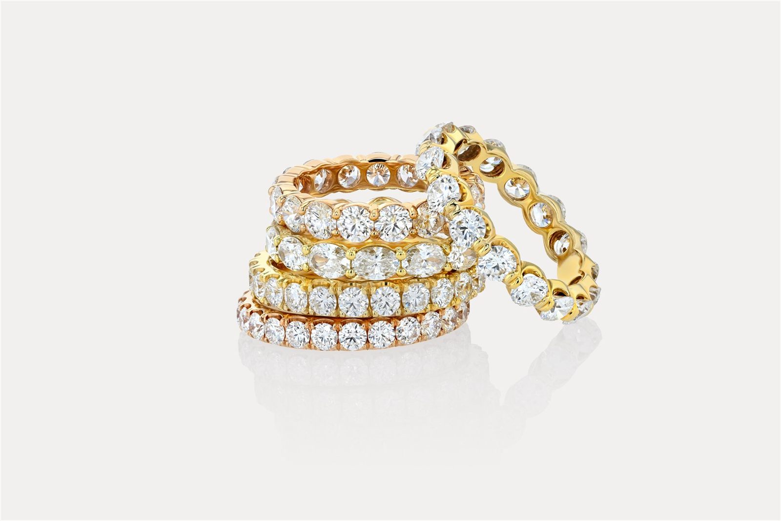 Stacked diamond eternity wedding bands in yellow, rose and white gold, Nathan Alan Jewelers Newport Beach