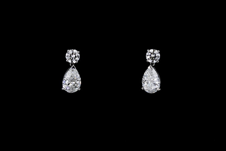 Round and Pear Shaped Dangling Diamond Earrings - Nathan Alan Jewelers